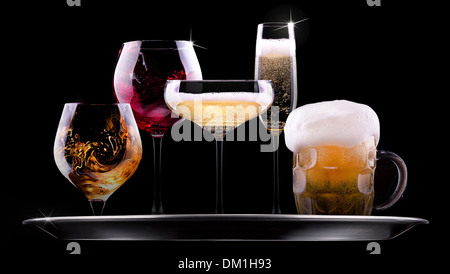 tray with different drinks on black background - champagne, beer, cocktail, wine, brandy, whiskey, scotch, vodka, cognac Stock Photo