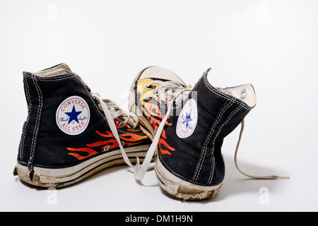 Worn and dirty Converse All Star shoes isolated on white background Stock Photo