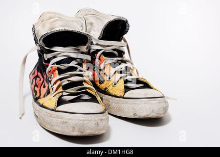 Worn and dirty Converse All Star shoes isolated on white background Stock Photo