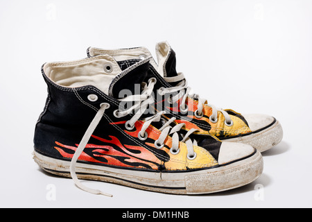 Worn and dirty Converse All Star shoes isolated on white background Stock Photo