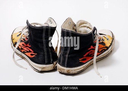 Worn and dirty Converse All Star shoes isolated on white background Stock Photo