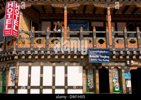 Bhutan, Bumthang Valley, Chamkhar town main bazaar, man on Kinley Hotel decorated balcony Stock Photo