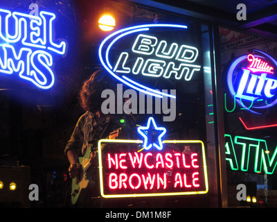Honky tonk bars and clubs line Broadway in downtown Nashville, Tennessee Stock Photo
