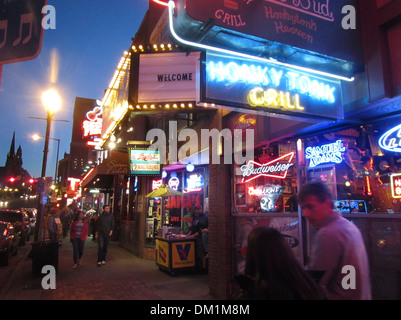 Exterior of Honky Tonk bars, lounges, and clubs and their neon signs on Broadway in downtown Nashville Tennessee. Stock Photo