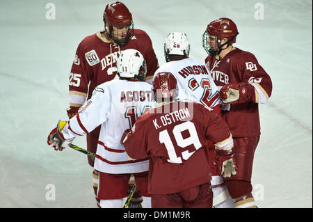 Jan. 01, 2010 - Denver, Colorado, USA - 01 January 2010:  Players start to fight before the referees break it up. Nebraska at Omaha Mavericks vs. Denver Pioneers during the Wells Fargo Denver Cup at Magness Arena in Denver, Colorado..Mandatory Credit: Andrew Fielding / Southcreek Global (Credit Image: © Andrew Fielding/Southcreek Global/ZUMApress.com) Stock Photo