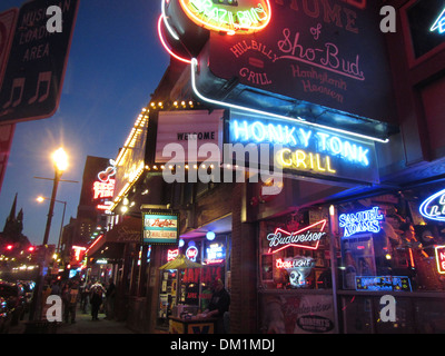 Exterior of Honky Tonk bars, lounges, and clubs and their neon signs on Broadway in downtown Nashville Tennessee. Stock Photo