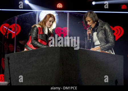 Chicago, Illinois, USA. 9th Dec, 2013. CAROLINE HJELT (L) and AINO JAWO Icona Pop performs onstage during 103.5 KISS FM's Jingle Ball 2013, presented by Jam Audio Collection, at United Center in Chicago, Illinois Credit:  Daniel DeSlover/ZUMAPRESS.com/Alamy Live News Stock Photo