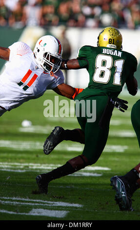 Miami (FL) linebacker Arthur Brown #11 attempts to take down South Florida wide receiver Dontavia Bogan #81 while he returns a kickoff during the first half of the game between the South Florida Bulls and the Miami Hurricanes being played at Raymond James Stadium in Tampa, Florida. (Credit Image: © Chris Grosser/Southcreek Global/ZUMApress.com) Stock Photo