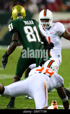 Miami (FL) wide receiver Kris Kimball #38 tries to take down South Florida wide receiver Dontavia Bogan #81 during the second half of the game between the South Florida Bulls and the Miami Hurricanes being played at Raymond James Stadium in Tampa, Florida. Miami defeated South Florida 31-10. (Credit Image: © Chris Grosser/Southcreek Global/ZUMApress.com) Stock Photo