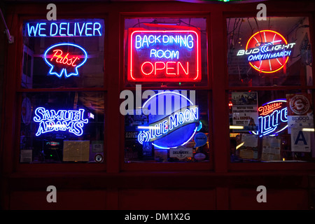beer neon signs in bar window Stock Photo