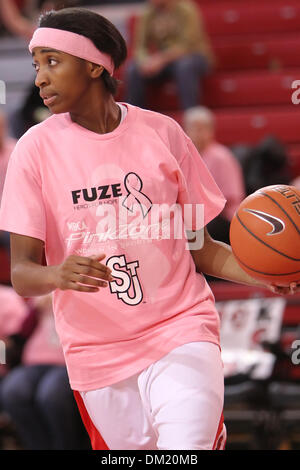 St. John's guard Shenneika Smith plays as she holds out a basketball ...
