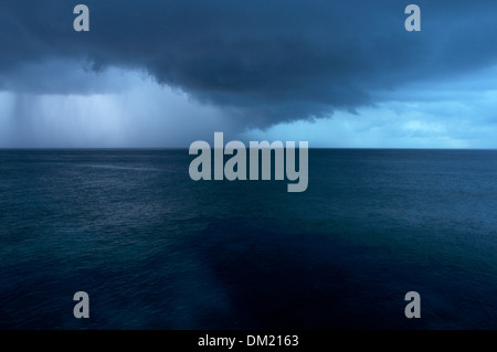 Dramatic Clouds over the Sea Viewed from Westside Cliffs near Negril, Jamaica Stock Photo