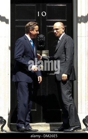 Italian Prime Minister Enrico Letta (R) shakes hands with British Prime Minister David Cameron Stock Photo