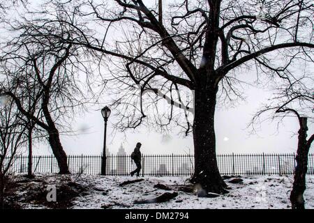 New York, USA. 10th Dec, 2013. A man walks during a snowfall in Central Park, New York City, United States, on Dec. 10, 2013. Credit:  Niu Xiaolei/Xinhua/Alamy Live News Stock Photo