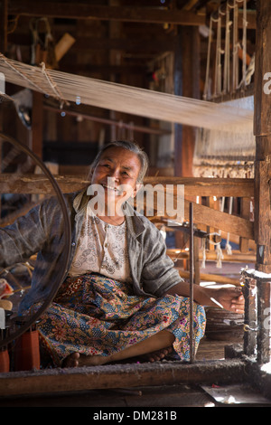 a woman weaving silk, In Phaw Khone, Inle Lake, Myanmar (Burma) Stock Photo