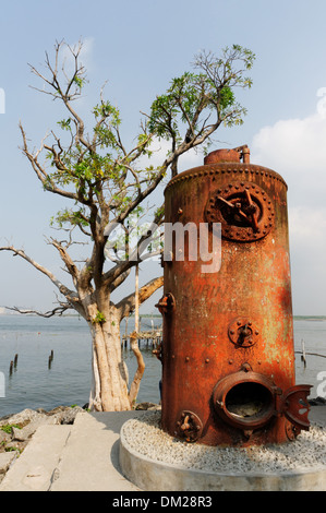 Old water boilers used as decoration on the seafront at Kochin in South India Stock Photo