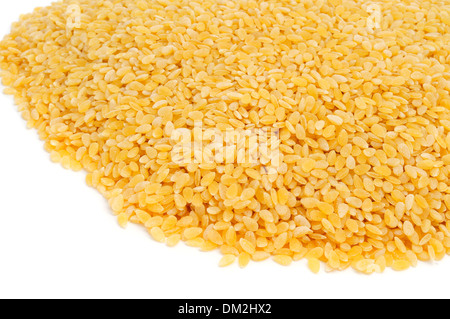 a pile of uncooked pastina, a variety of tiny pieces of pasta used in broth soups, on a white background Stock Photo