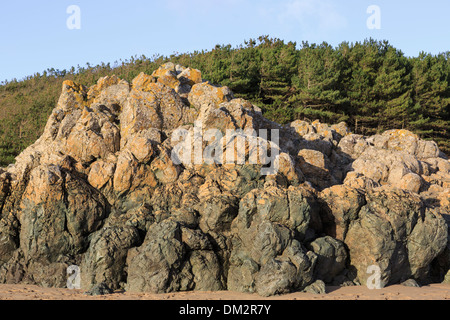 Basaltic Pillow lava rocks exposed on Llanddwyn beach in island Geopark at Newborough Forest, Isle of Anglesey, North Wales, UK, Britain Stock Photo