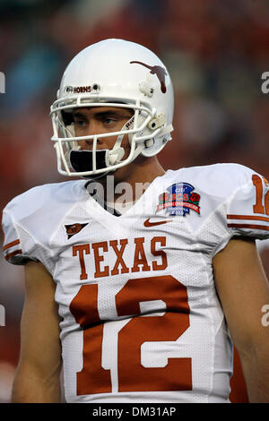 Texas quarterback Colt McCoy (12) rolls out during an NCAA college ...