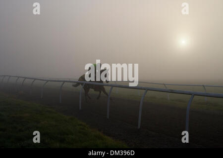 Middleham, Yorkshire, UK. 11th December 2013.   Early morning Uk Weather with Uk Weather Fog & Inversion Layer over Middleham Gallops, North Yorkshire Dales.   Middleham now boasts its own grass and all-weather gallops with horsetrack plastic running rail on the Low and High Moors.  Middleham is established as a leading training centre in the UK where fifteen trainers are based. The facilities and layout have continued to improve allowing trainers to send out fit and competitive athletes and have been rewarded with further success at the top level. © Mar  Photographics/Alamy Live Stock Photo