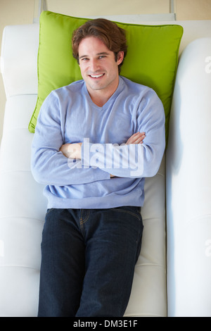 Overhead View Of Man Relaxing On Sofa Stock Photo