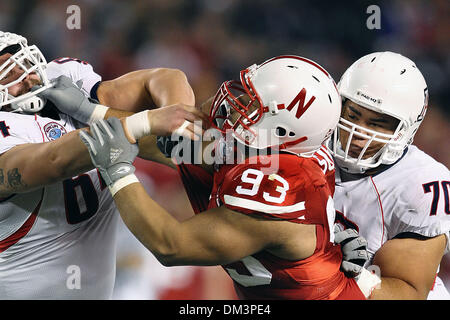 Nebraska defensive tackle Ndamukong Suh #93 and Arizona center Colin Baxter  #64 mix it up during game action in the Pacific Life Holiday Bowl at  Qualcomm Stadium San Diego, CA. Nebraska defeated