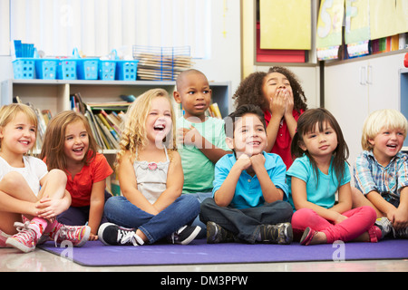 Group of Elementary Pupils In Classroom Stock Photo