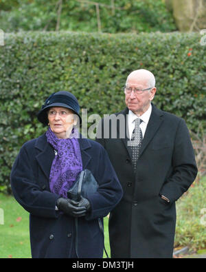 Altrincham, Cheshire, UK. 11th December 2013. Sir Bobby Charlton and his wife, Norma, attend the funeral of Bill Foulkes, who died on November 25th. Bill was one of the Busby Babes, who survived the Munich air crash in February 1958  was captain and played 688 times for Manchester United. Bill Foulkes Funeral  Altrincham  Cheshire  11 December 2013 Credit:  John Fryer/Alamy Live News Stock Photo