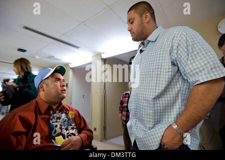 Tennessee Titans offensive lineman Eugene Amano, who grew up in San Diego CA, presented Chris Anguiano with a throwback jersey and a cap at Palomar Hospital where Anguiano receives physical therapy. Anguiano was severly injured in a hatchett attack by a Border Patrol agent, who broke into a home in Escondido CA trying to kill his estranged wife on July 9 2009. Amano, a 2000 graduat Stock Photo