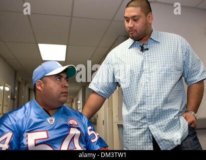 Tennessee Titans offensive lineman Eugene Amano, who grew up in San Diego CA, presented Chris Anguiano with a throwback jersey and a cap at Palomar Hospital where Anguiano receives physical therapy. Anguiano was severly injured in a hatchett attack by a Border Patrol agent, who broke into a home in Escondido CA trying to kill his estranged wife on July 9 2009. Amano, a 2000 graduat Stock Photo