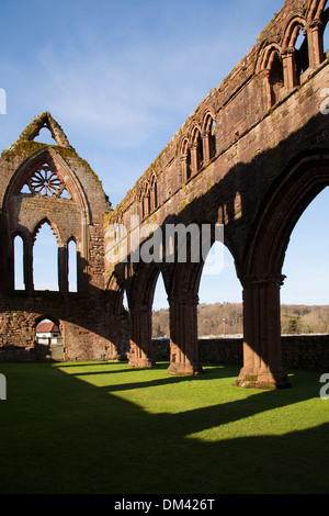 The ruins of Sweetheart Abbey in the afternoon sun, New Abbey Bridge, Dumfries and Galloway. Stock Photo