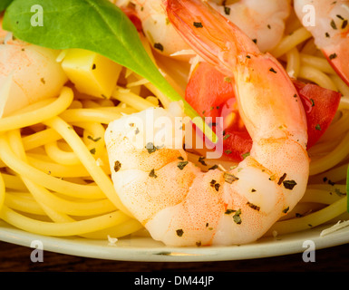 closeup detail of fresh king sized prawn and spaghetti pasta Stock Photo