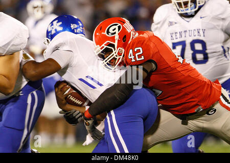 Georgia defensive end Justin Houston (42) tackles Kentucky quarterback Morgon Newton (12) at the game against Kentucky at Sanford Stadium at the University of Georgia in Athens, Ga., on Saturday, November 21, 2009. The Wildcats beat the Bulldogs 34-27. (Credit Image: © Daniel Shirey/Southcreek Global/ZUMApress.com) Stock Photo