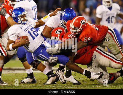 Georgia defensive lineman Jeff Owens (95) sacks Kentucky quarterback Morgon Newton (12) at the game against Kentucky at Sanford Stadium at the University of Georgia in Athens, Ga., on Saturday, November 21, 2009. The Wildcats beat the Bulldogs 34-27. (Credit Image: © Daniel Shirey/Southcreek Global/ZUMApress.com) Stock Photo