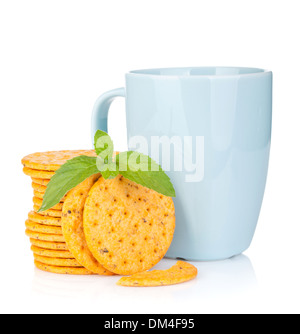Stack of crackers with mint and cup of drink. Isolated on white background Stock Photo
