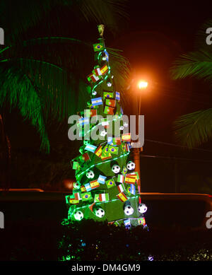 Costa do Sauipe, Brazil. 6th Dec, 2013. A soccer decorated Christmas tree stands illuminated on a premises in the city of Costa do Sauipe, Brazil, 6 December 2013. Brazil is preparing for the forthcoming 2014 soccer world cup. Photo: Marcus Brandt/dpa/Alamy Live News Stock Photo