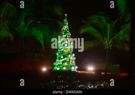 Costa do Sauipe, Brazil. 6th Dec, 2013. A soccer decorated Christmas tree stands illuminated on a premises in the city of Costa do Sauipe, Brazil, 6 December 2013. Brazil is preparing for the forthcoming 2014 soccer world cup. Photo: Marcus Brandt/dpa/Alamy Live News Stock Photo