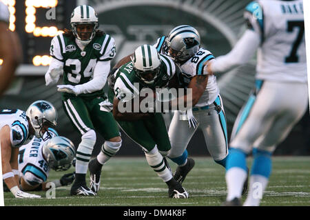 27 September 2009: Tennessee Titans #28 Chris Johnson gets caught. The New  York Jets defeated the Tennessee Titans 24-17 at Giants Stadium in  Rutherford, New Jersey. In honor of AFL Legacy weekend