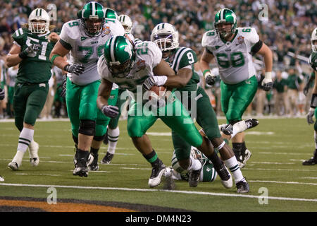 26 December 2009:  Marshall Thundering Herd running back Martin Ward (29) carries Ohio Bobcats Julian Posey (9) into the end zone as he scores a touchdown during the Little Caesars Pizza Bowl between the Marshall Thundering Herd and the Ohio Bobcats at Ford Field in Detroit Michigan.  Ward was named the gameÃ•s Most Valuable Player as the Marshall Thundering Herd defeated the Ohio  Stock Photo