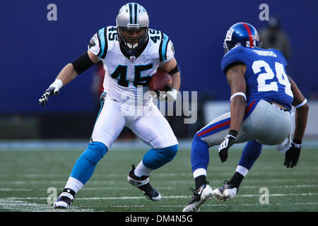 New York Giants cornerback Terrell Thomas (24) pushes Tennessee Titans  running back Chris Johnson (28) out of bounds after a 42-yard run during  fourth quarter NFL football action between the New York