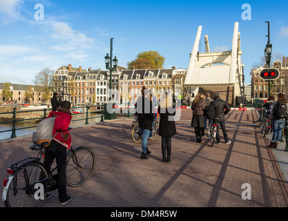 MAGERE BRIDGE OVER THE RIVER AMSTEL  AMSTERDAM OPENING TO ALLOW A BARGE PASS THROUGH Stock Photo