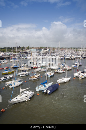 Boats moored on the Lymington River in Lymington, Hampshire, England, UK Stock Photo