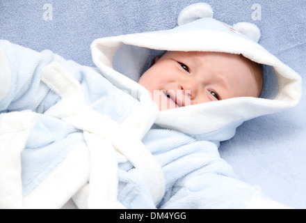 little baby crying on bed Stock Photo
