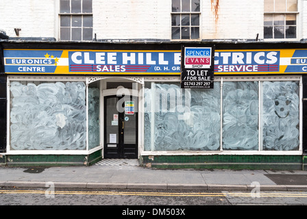 Closed shop with whitewashed windows, Church Stretton, Shropshire Stock Photo