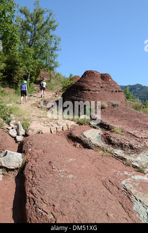 Walkers or Hikers on Long Distance Footpath or Trail in Daluis Gorge Haut-Var Alpes-Maritimes France Stock Photo