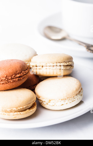 Three colors of macaroons in brown and beige tones Stock Photo