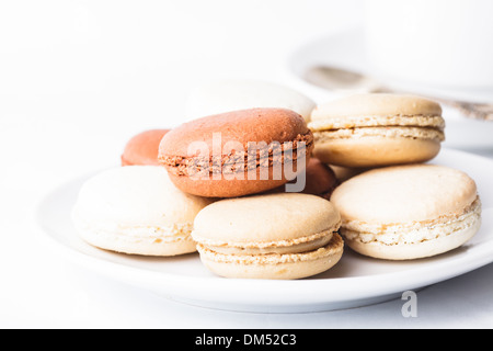 Three colors of macaroons in brown and beige tones Stock Photo