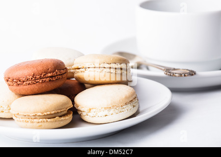 Three colors of macaroons in brown and beige tones Stock Photo