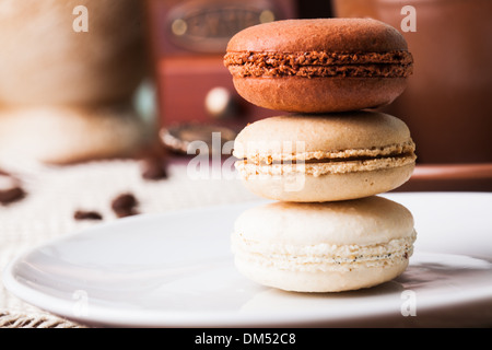 Three colors of macaroons in brown and beige tones Stock Photo