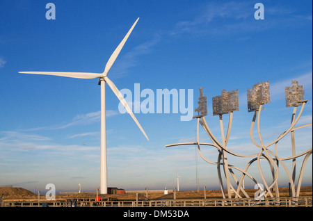 Biggest land based wind turbine alongside artwork Blyth harbour,north east England, UK Stock Photo